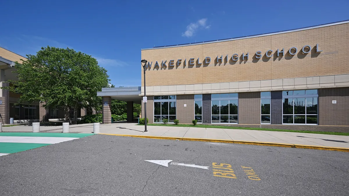 The front of Wakefield High School with the entrance to the left and the school name on the building. Wakefield H.S. is part of Arlington County Public Schools. 1325 South Dinwiddie Street, Arlington, Virginia 22206.